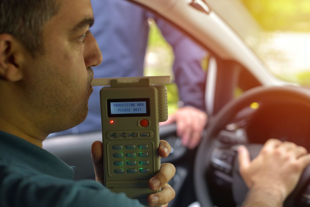man taking blood alcohol test